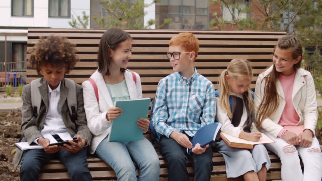 Group-of-Pupils-Sitting-on-Bench