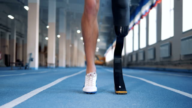 Close-up-of-a-male-artificial-leg-being-warmed-up-before-jogging