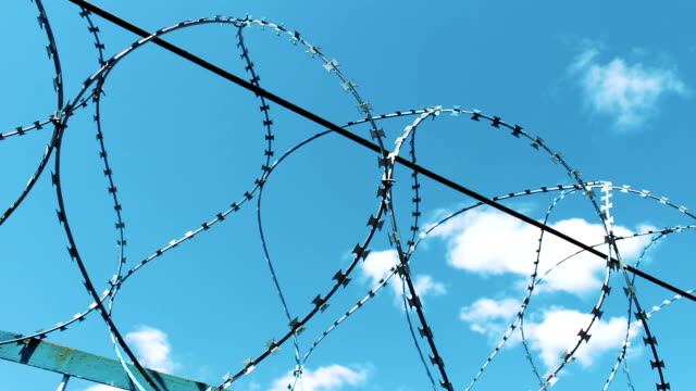 Fence-with-barbed-wire.-Closed-territory-protection