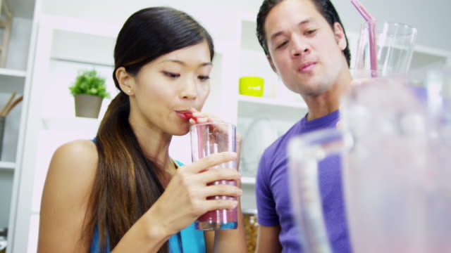 Healthy-lifestyle-Ethnic-couple-drinking-organic-fruit-smoothie