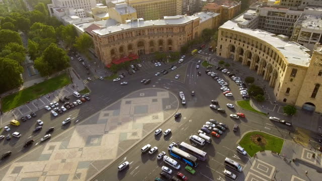 Automobiles-driving-on-Republic-square-in-Yerevan,-aerial-view-of-main-street