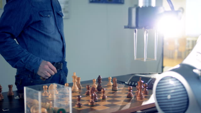 Innovative-gaming-emulator,-robot-playing-chess-with-a-human.-Futuristic-robotic-concept.