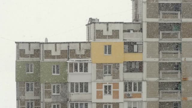 Snowfall-in-the-city.-View-from-the-window-to-the-street-snow.-Close-up