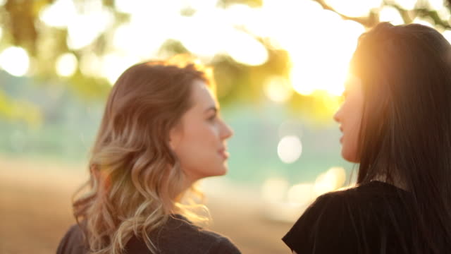 LGBT-female-couple-together-at-the-park-during-sunset-golden-hour-time