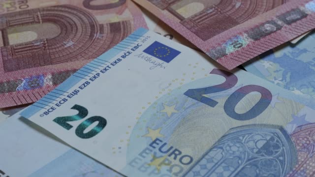 Banking-and-money-background-of-European-Union-currency-on-table-4K-2160p-30fps-UltraHD-footage---Lot-of-different-Euros-money-and-business-background-4K-3840X2160-UHD-video