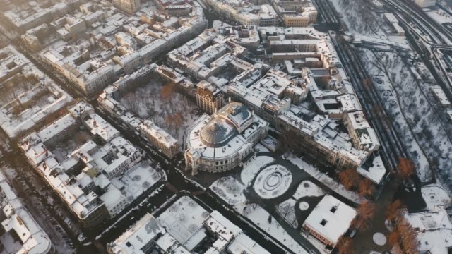 Cinematic-aerial-footage-of-old-city-center-and-opera-and-ballet-theatre-during-sunny-winter-day