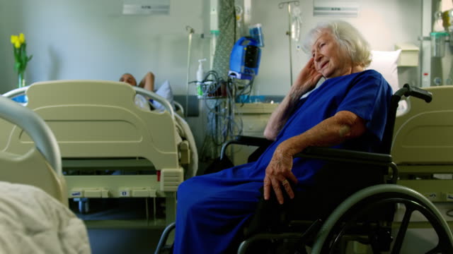Senior-patient-sitting-on-wheelchair-4k