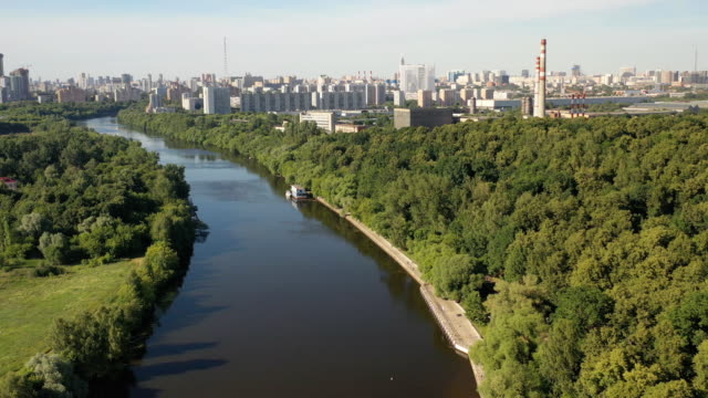 Air-view-of-the-metropolis-on-a-summer-day-from-the-floodplain-of-the-river-and-green-areas