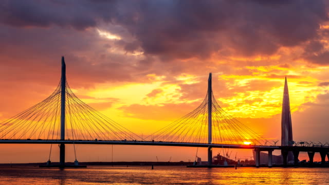 Timelapse-St.-Petersburg-cable-stayed-bridge-at-sunset.-Malaya-Neva-River,-Zenit-Arena-and-Gazprom-Lakhta-Center