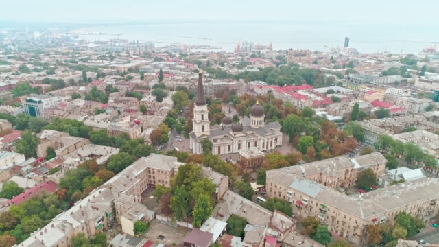 Cinematic-aerial-view-of-Transfiguration-Cathedral-and-Odessa-old-city-center-on-cloudy-day.