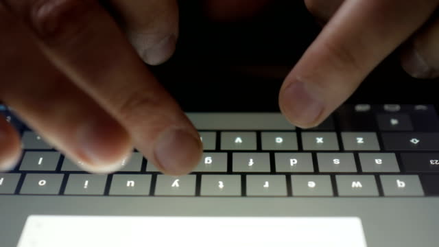 Typing-on-a-virtual-keyboard-of-tablet-pc.-Finger-touching-virtual-keys-form-a-digital-keyboard-of-a-touchscreen-tablet-PC.-A-person-writes-a-text-message.-Texting.