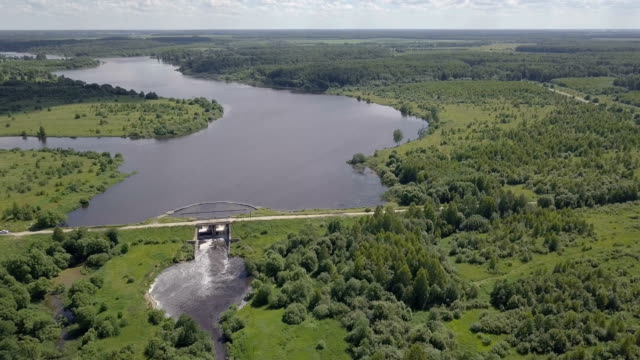 Aerial-shot-of-the-dam.-The-wide-river-becomes-narrow.