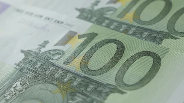 Lot-of-EU-banknotes-on-table-shallow-DOF-close-up