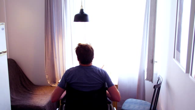 Disable-man-in-wheelchair-in-the-room