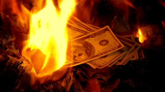 Cash-Is-Thrown-On-Fire
