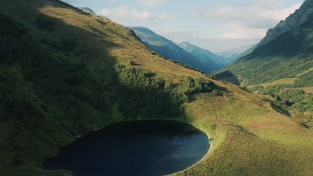 Aerial-view;-drone-moving-over-mountain-lake