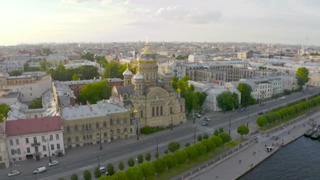 Aerial-view-of-the-Assumption-Church-and-the-embankment-of-the-Neva-River-in-Petersburg-in-the-evening-at-sunset