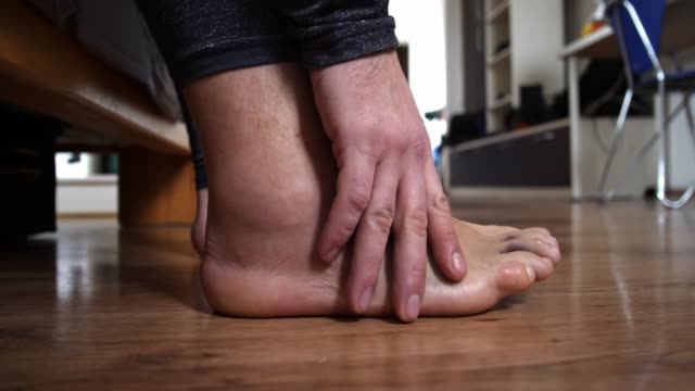 Men-leg-after-a-sprained-ligament-injury-close-up-walk