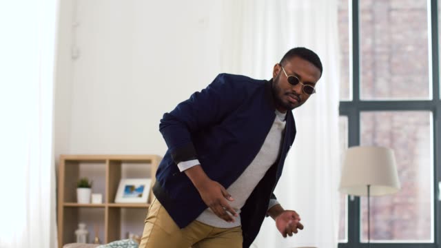 young-african-american-man-dancing-at-home