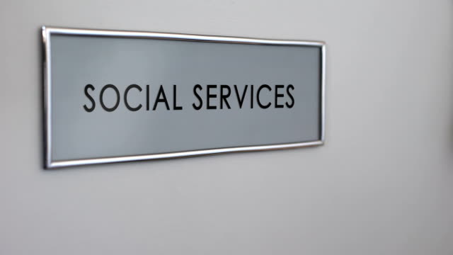Social-services-office-door,-hand-knocking,-senior-people-support,-volunteering