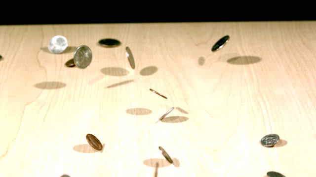 slow-motion-coins-bouncing-on-table