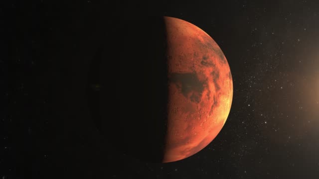 Planet-Mars.-The-camera-is-approaching-Mars.-View-from-space.-Stars-twinkle.-4K.-Sun-on-the-right.-The-planet-is-illuminated-by-the-sun-to-half.