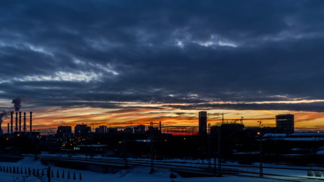 running-sunset-clouds-and-city-skyline;-time-lapse