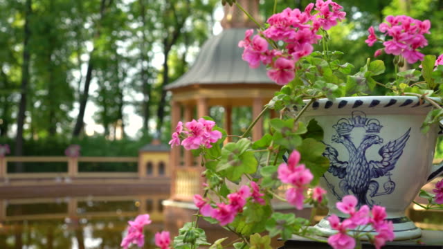 View-of-the-pond,-gazebo-and-old-vase