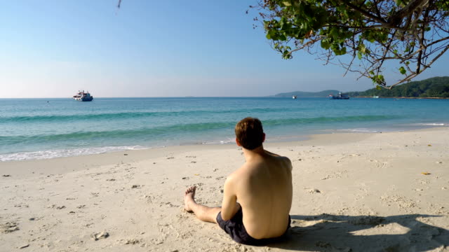 Internet,-Social-Media-And-Phone-Addiction---Man-Staring-at-Smartphone-While-Ignoring-Beautiful-Beach