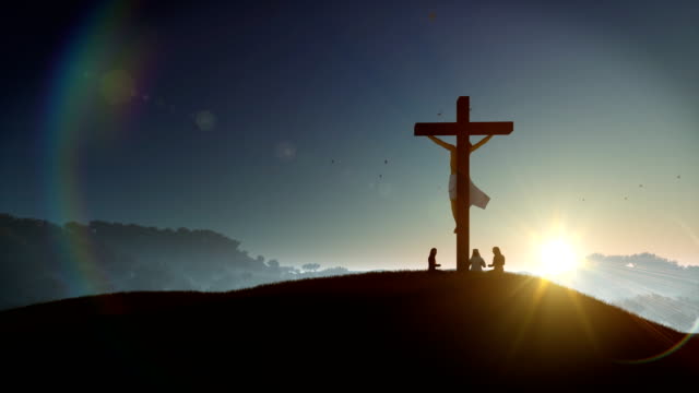 Christians-praying-at-Jesus-cross-at-sunset,-4K