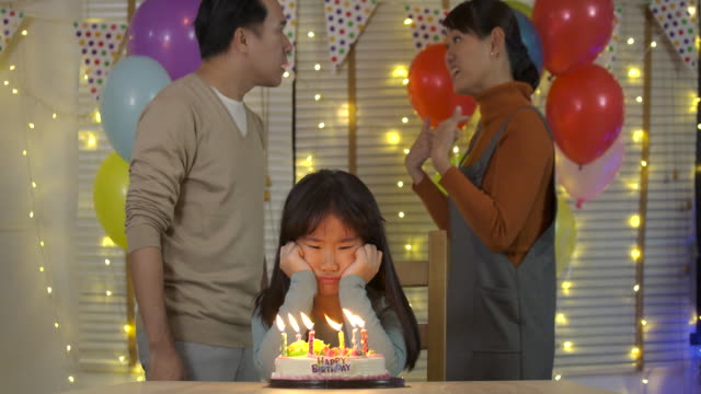 Husband-and-wife-quarrel.-Little-girl-is-sad-because-of-her-parents-quarrelling-in-her-birthday-party-in-slow-motion.