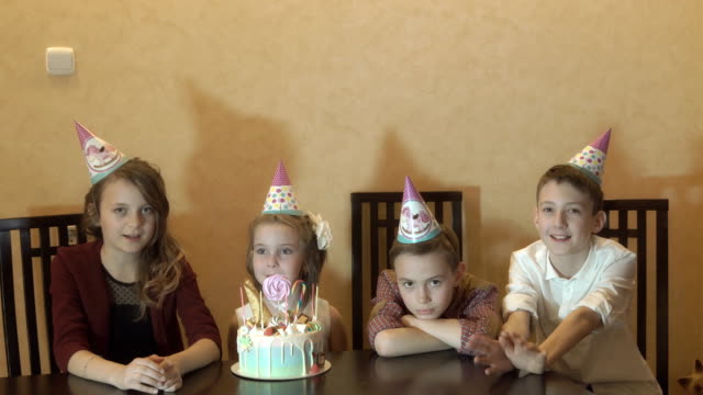 Children-boring-on-birthday-party.-birthday-cake-for-little-birthday-girl.