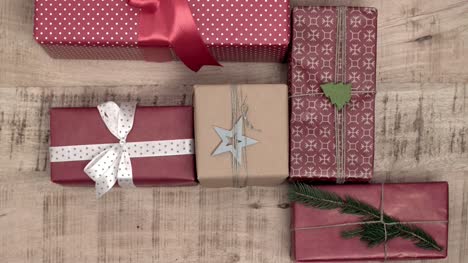 Stack-of-christmas-presents-on-wooden-background