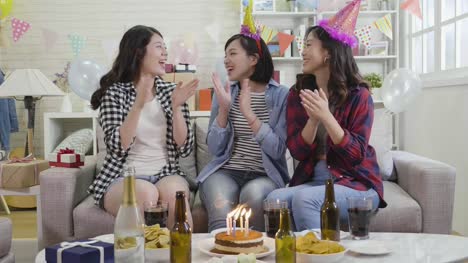 ladies-happily-singing-songs-celebrating-birthday