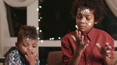 Two-black-boys-destroying-cake.