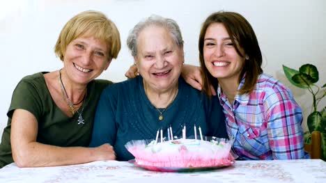 Happy-Grandmother's-birthday,-daughter-and-grandaughter-celebrating-her