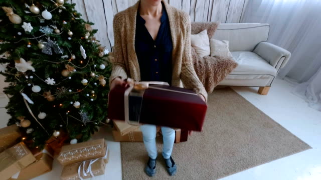Woman-giving-gift-box