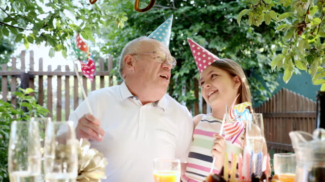 Grandpa-and-granddaughter-celebrate-together
