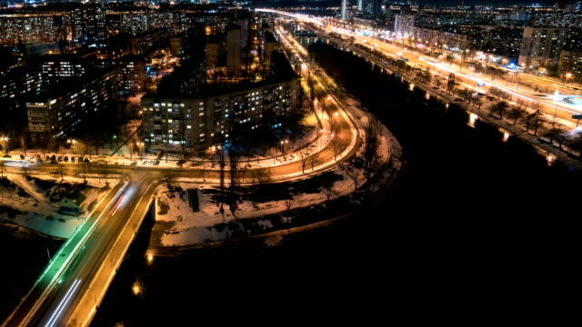 The-picturesque-view-on-the-evening-city-with-a-river.-time-lapse