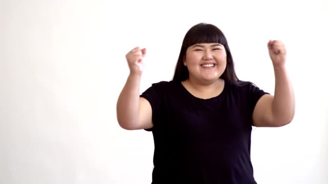 authentic-Asian-girl-dancing-and-enjoying-life-on-white-background.-Life-outside-of-the-stereotypes-of-today's-youth.-Concept-idea