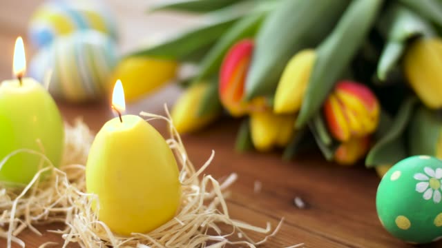 candles-in-shape-of-easter-eggs-and-flowers