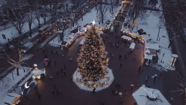 Lviv,-Ukraine---December-2018.-Arial-shot.-Lvov-Opera-house.-Christmas-tree.-Christmas-Fair.-People-are-walking-around-the-city-center.-Night-time