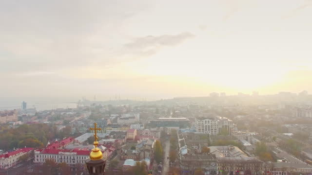 Aerial-view-of-Orthodox-Cross-over-the-old-city-center-of-Odessa-on-hazy-misty-early-morning.-Religion-concept.