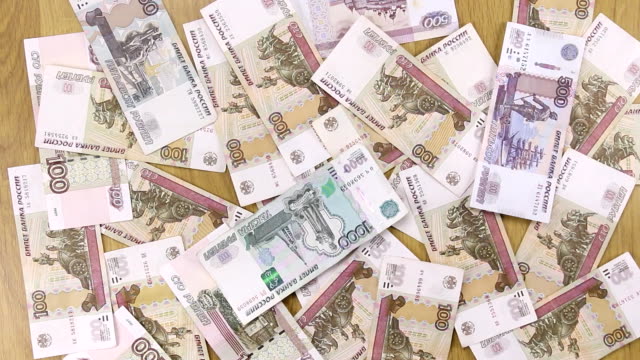 Wind-blows-away-the-rubles-from-the-table-businessman.-Paper-money