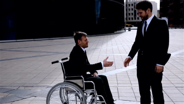Happy-Entrepreneur-Shaking-Hands-With-Disabled-Employee