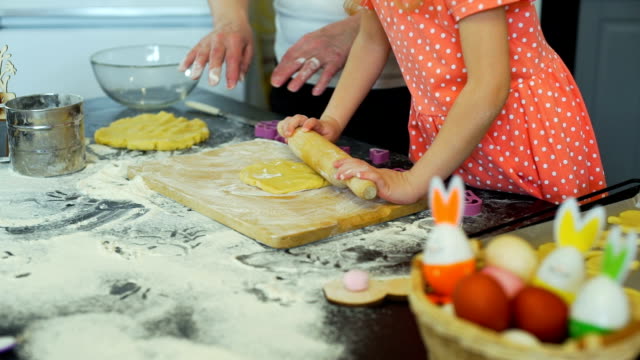 Girl-and-Grandma-Preparing-Dough-for-Cookies