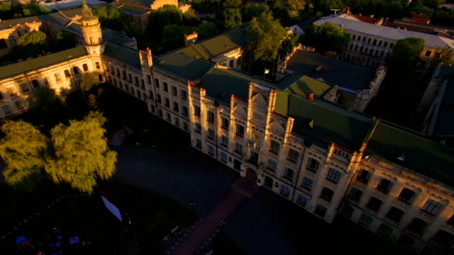 Old-colledge-on-the-background-of-the-city-at-sunset-aerial