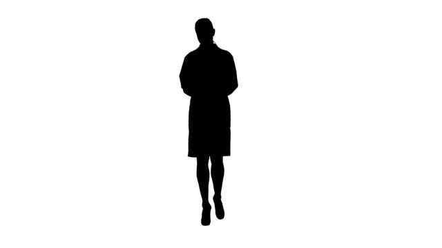 Silhouette-Doctor-using-tablet-while-walking