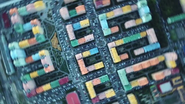 Top-view-of-the-colorful-buildings,-aerial-footage-from-the-drone-on-Comfort-Town.-Kiev,-Ukraine.