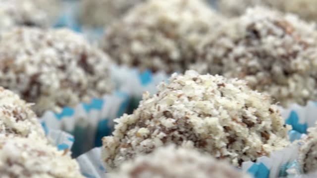 Chocolate-coconut-candy-balls,-closeup-dolly-shot-background